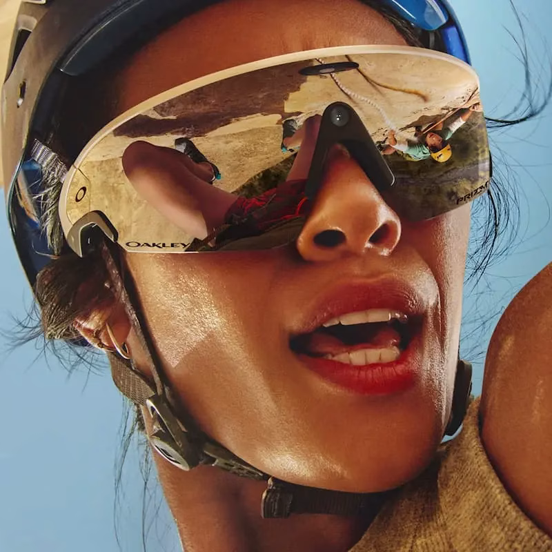 Single woman wearing Oakley Meta Vanguard sunglasses.